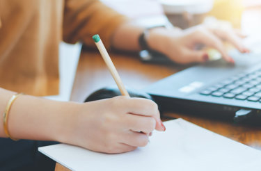person-writing-down-notes