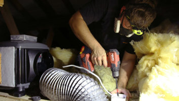man-installing-positive-input-ventilation