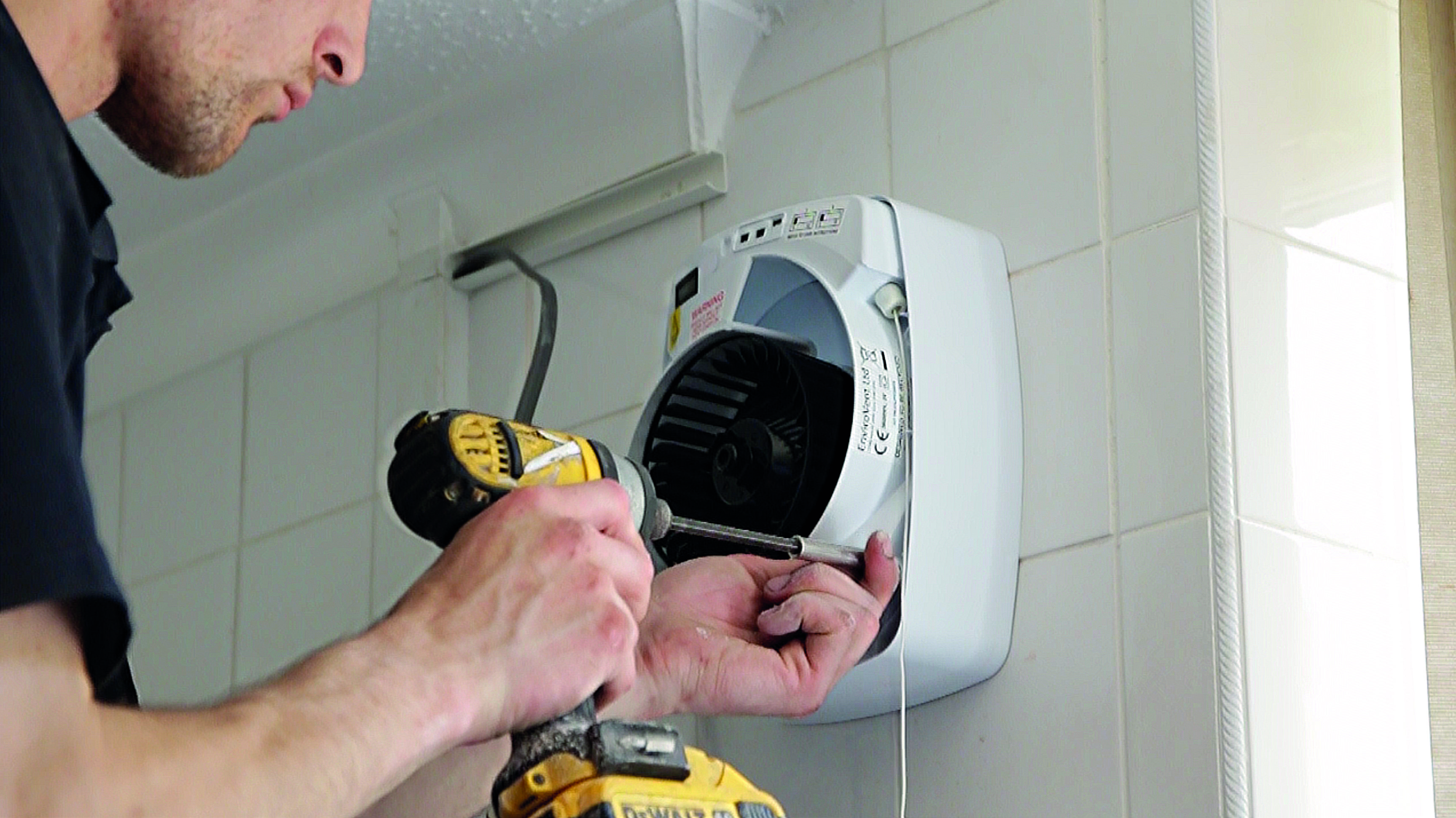 man-installing-extactor-fan