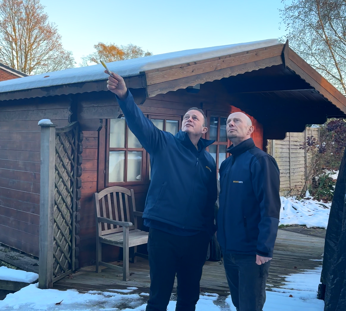 two-men-inspecting-exterior-property