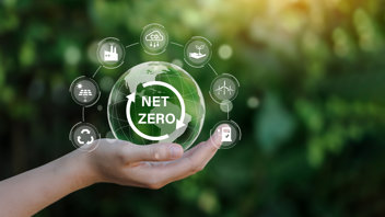 A symbol with arrows going around in a circle that says "Net Zero" in the middle